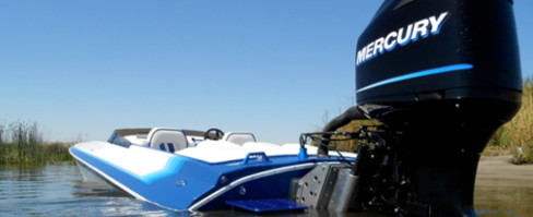 2017 a boat parked near Greg's Outboards sign.